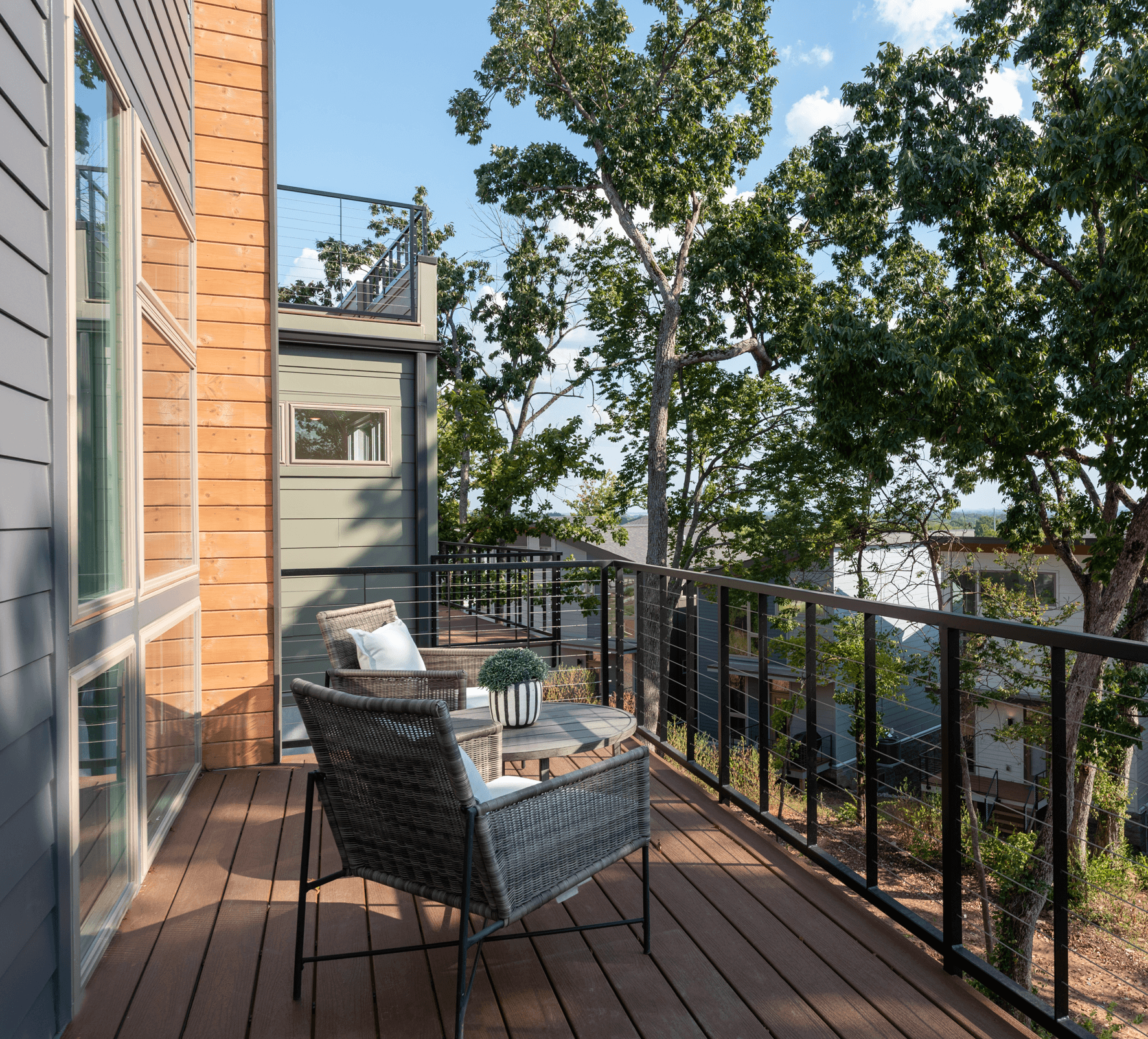 View of the shared treed courtyard at High View Cottages